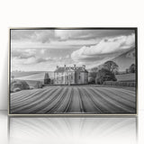 Framed acrylic wall art showcasing a serene countryside landscape with vibrant green fields and a bright blue sky, designed to enhance home decor with elegance.
