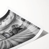 Rolled print of a serene countryside landscape featuring vibrant green fields, a blue sky, and distant hills, designed for wall art decoration in homes.