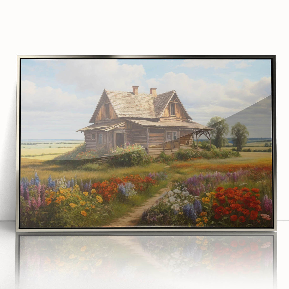 Framed wall art showcasing a serene countryside landscape, featuring vibrant green fields and a clear blue sky, elegantly displayed in a sleek silver frame, perfect for home decor.