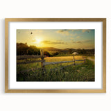 Elegant framed wall art showcasing a serene countryside landscape, featuring lush green fields and a bright blue sky, accented with a gold frame for a sophisticated touch.