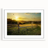 Framed landscape wall art featuring a serene countryside scene, showcasing lush green fields and a vibrant blue sky, perfect for home decor enhancement.