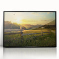 Framed acrylic wall art featuring a serene countryside landscape with rolling hills, greenery, and a tranquil sky, presented in a sleek black frame for modern decor.