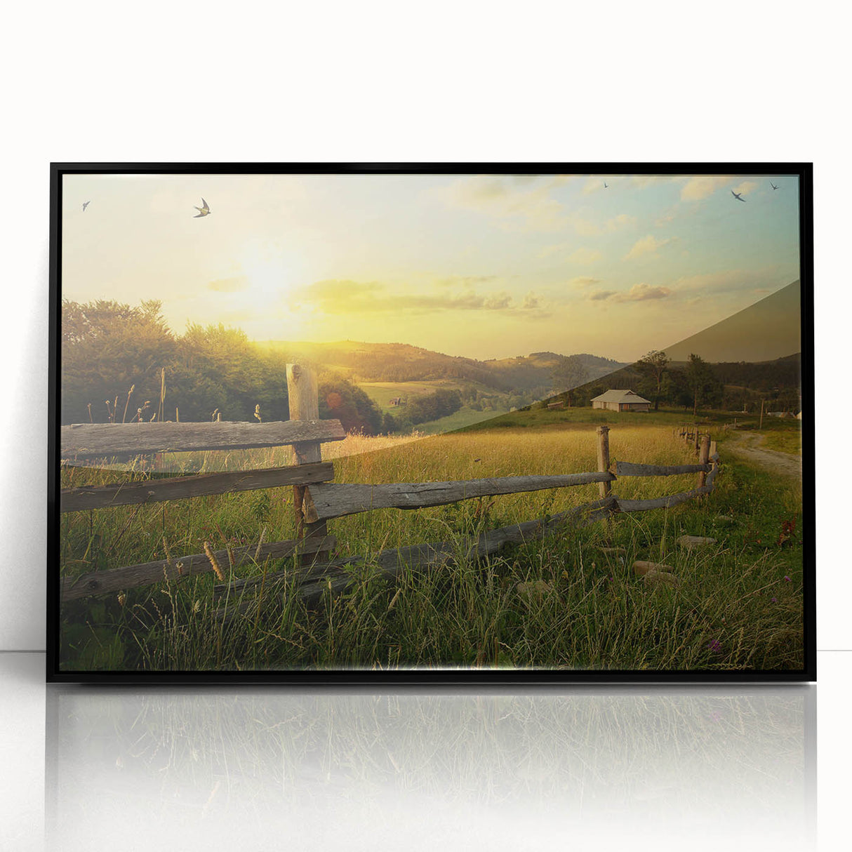 Framed acrylic wall art featuring a serene countryside landscape with rolling hills, greenery, and a tranquil sky, presented in a sleek black frame for modern decor.