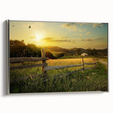 Framed canvas wall art showcasing a serene countryside landscape, featuring lush green fields and a tranquil sky, elegantly displayed with a silver frame.