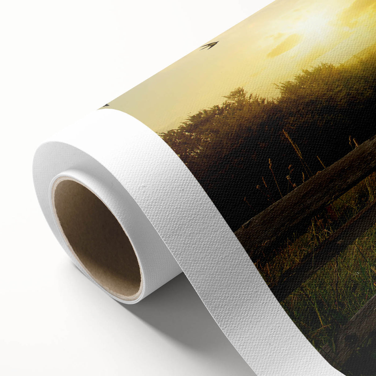 Vibrant rolled canvas artwork depicting a tranquil countryside landscape with rolling hills and a colorful sunset sky, ideal for home decor and art lovers.
