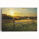 Vibrant stretched canvas wall art depicting a serene countryside landscape with rolling hills, lush greenery, and a clear blue sky, ideal for home decor.