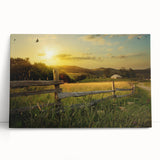 Stretched canvas artwork depicting a serene countryside landscape with rolling hills, vibrant greenery, and a tranquil sky, perfect for home decor.