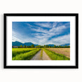 Framed wall art collection showcasing a serene countryside landscape with vibrant colors and a black mat, perfect for home decor. Ideal for nature lovers.
