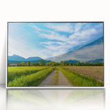 Framed acrylic wall art showcasing a serene countryside landscape design, featuring vibrant colors and intricate details, ideal for enhancing home decor.