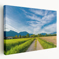 Stretched canvas wall art showcasing a serene countryside landscape with vibrant greens and blues, ideal for enhancing home decor and creating a tranquil atmosphere.