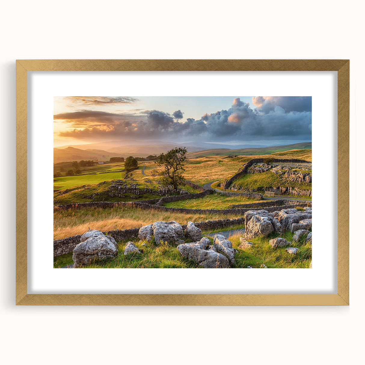Framed wall art collection showcasing a serene countryside landscape with a gold mat, perfect for home decor, enhancing interiors with nature's beauty.