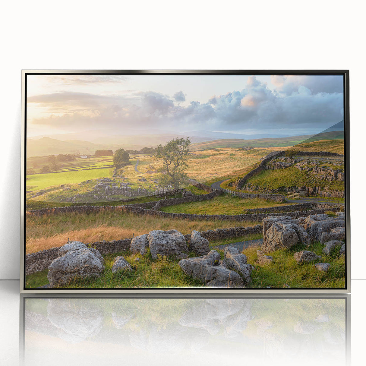 Framed acrylic wall art featuring a serene countryside landscape, showcasing rolling hills, vibrant greenery, and a clear blue sky, perfect for home decor.