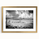 Elegant gold-framed wall art featuring a serene countryside landscape design, complete with a white mat for added sophistication. Ideal for enhancing home decor.