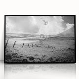Framed acrylic wall art showcasing a serene countryside landscape in vibrant colors, featuring lush green fields and a clear blue sky, perfect for home decor.