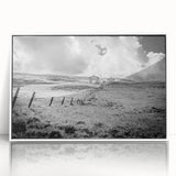 Framed landscape wall art featuring a serene countryside scene with vibrant colors and intricate details, set against a sleek white frame, perfect for home decor.