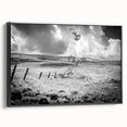 Framed canvas wall art showcasing a serene countryside landscape with lush greenery and a tranquil sky, featuring a sleek black frame for elegant decor.