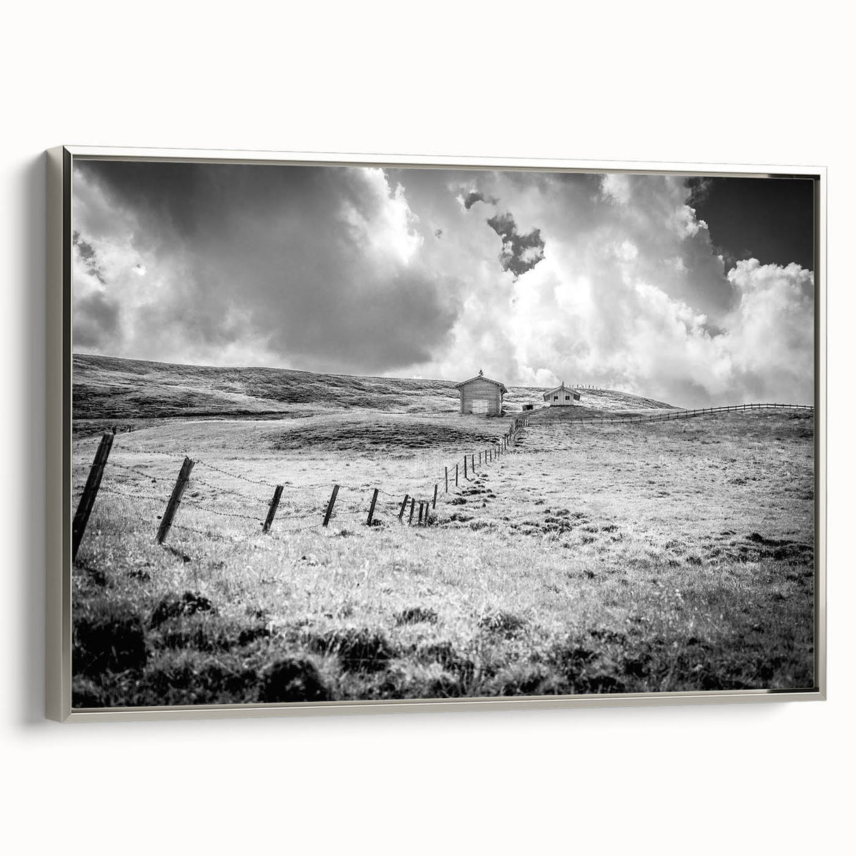 Framed canvas wall art showcasing a serene countryside landscape design with vibrant greens and blues, elegantly bordered in silver. Ideal for home decor and art lovers.