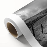 Vibrant rolled canvas wall art showcasing a serene countryside landscape with rolling hills, lush greenery, and a bright blue sky, ideal for home decor.