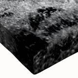 Close-up of a stretched canvas wall art piece showcasing a vibrant countryside landscape design, featuring lush green fields and a serene blue sky, ideal for home decor.