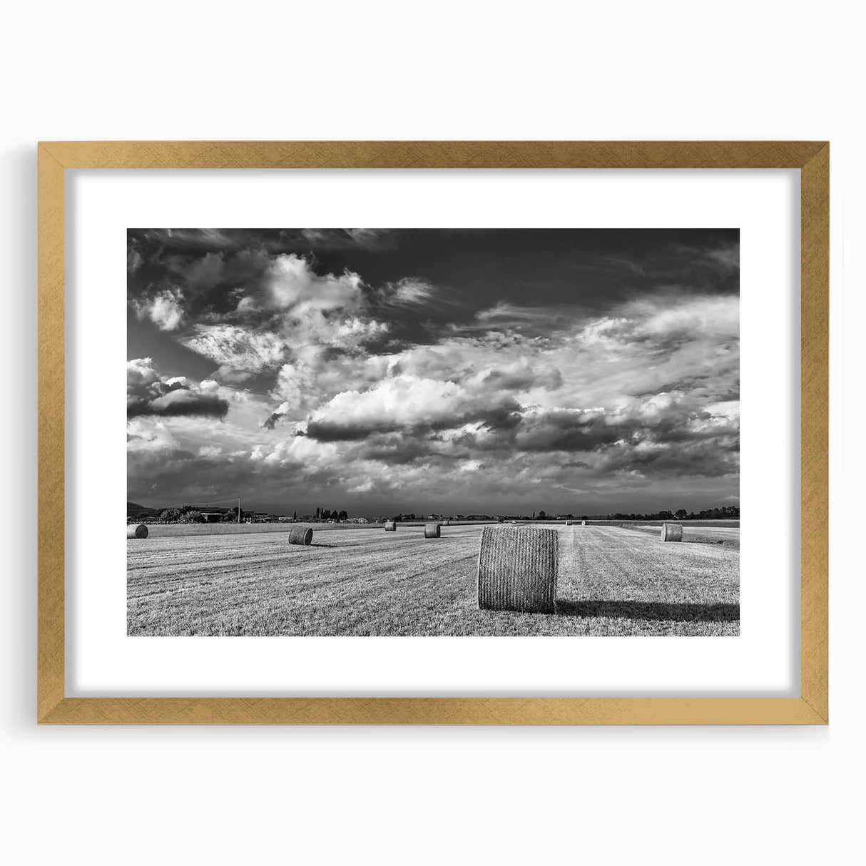 Gold-framed wall art featuring a serene countryside landscape design, showcasing lush greenery and rolling hills, ideal for enhancing home decor aesthetics.