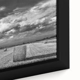 Framed canvas wall art showcasing a vibrant countryside landscape, featuring lush green fields, a blue sky, and subtle earthy tones, ideal for home decor.