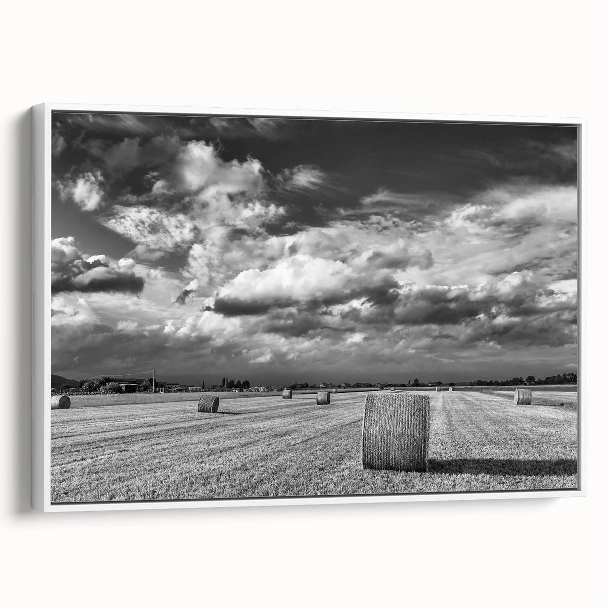 Framed canvas wall art showcasing a serene countryside landscape design, featuring lush greenery and rolling hills, with a sleek white frame enhancing its elegant appeal. Perfect for home decor.