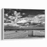 Framed canvas wall art showcasing a serene countryside landscape design, featuring lush greenery and rolling hills, with a sleek white frame enhancing its elegant appeal. Perfect for home decor.