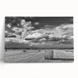 Stretched canvas wall art showcasing a serene countryside landscape with lush green fields and a vibrant sunset, perfect for home decor enhancement.