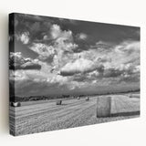 Stretched canvas wall art showcasing a serene countryside landscape with vibrant green fields, rolling hills, and a clear blue sky, perfect for home decor.