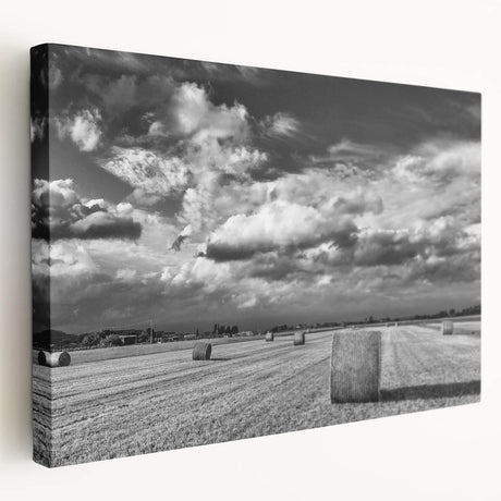 Stretched canvas wall art showcasing a serene countryside landscape with vibrant green fields, rolling hills, and a clear blue sky, perfect for home decor.