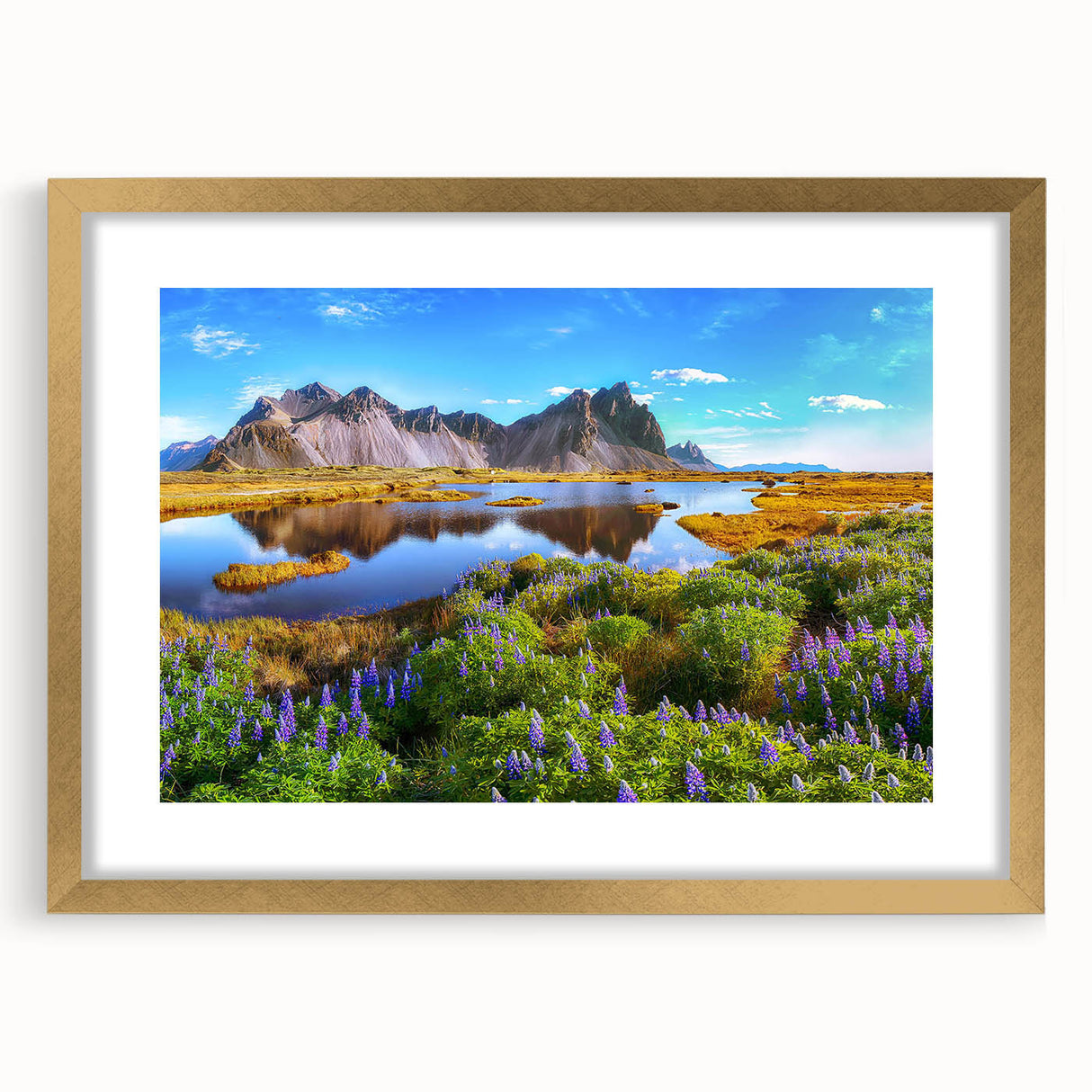 Framed wall art collection showcasing a serene countryside landscape with vibrant greens and soft blues, elegantly presented with a gold mat and frame.