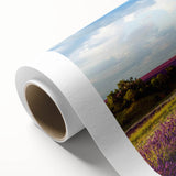 Rolled canvas showcasing a serene countryside landscape design, vibrant green fields and a dramatic sky with clouds, ideal for home decor enhancement.