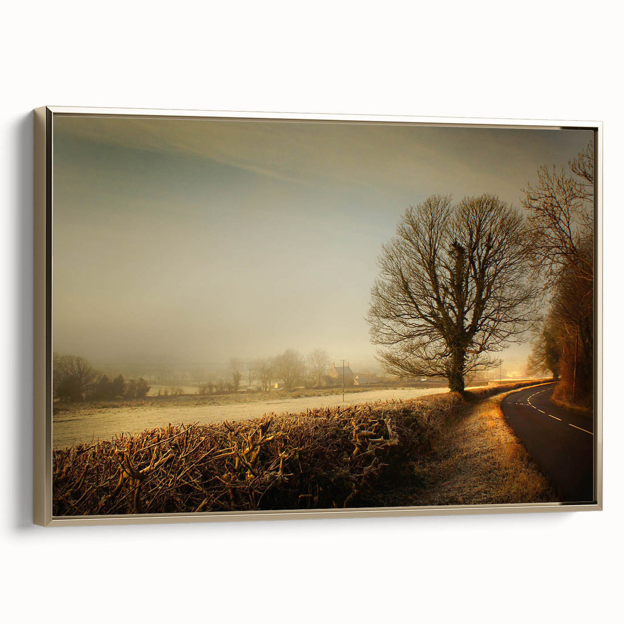 Framed canvas wall art showcasing a serene countryside landscape with vibrant greens and golden hues, perfect for home decor in a rustic setting.
