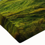 Close-up of a vibrant countryside landscape wall art design on stretched canvas, featuring lush green fields and a serene blue sky, perfect for home decoration.