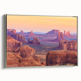 Framed canvas wall art showcasing a serene desert landscape with soft hues of beige and warm tones, elegantly displayed with a silver frame for a modern touch.
