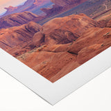 Desert landscape wall art featuring warm tones of orange and brown, depicting rolling dunes and a dramatic sunset, ideal for home decor or artistic displays.