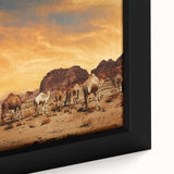 Framed canvas artwork showcasing a vibrant desert landscape with warm tones of orange and red, highlighting unique rock formations and a clear blue sky, perfect for home decor.