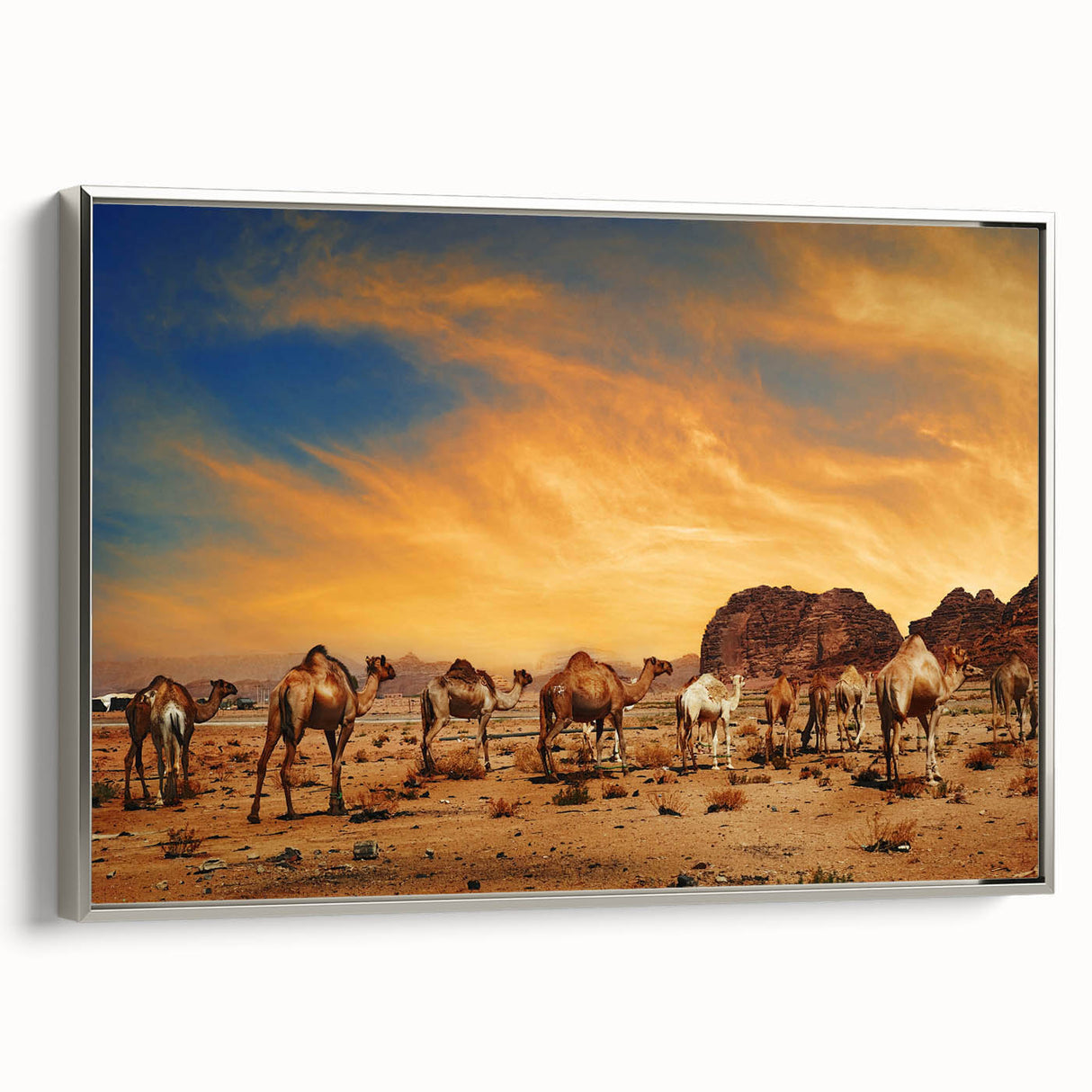Framed canvas wall art showcasing a stunning desert landscape design, featuring warm colors and intricate details, elegantly displayed with a silver frame.