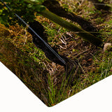 Close-up of a stretched canvas featuring a vibrant desert landscape design, showcasing rich colors and detailed textures, ideal for modern home decor.