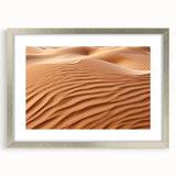 Framed desert landscape wall art design featuring warm colors and intricate details, presented in a sleek silver frame with a matte finish, perfect for home decor.