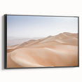 Framed canvas wall art showcasing a serene desert landscape with warm earth tones, displayed in a sleek black frame from the Desert Design collection.