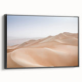 Framed canvas wall art showcasing a serene desert landscape with warm earth tones, displayed in a sleek black frame from the Desert Design collection.