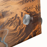 Close-up of a stunning acrylic glass wall art piece showcasing a vibrant desert landscape design, featuring warm hues of orange and gold, perfect for modern decor.