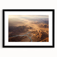 Framed black wall art showcasing a stunning desert landscape design, featuring warm tones of orange and brown. Perfect for modern home decor and art enthusiasts.