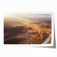 Desert landscape wall art print showcasing vibrant hues of orange and red, featuring rolling sand dunes under a clear blue sky, ideal for modern home decor.