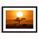 Framed desert landscape wall art collection showcasing warm hues of orange and yellow, set in a sleek black frame with a white mat, ideal for modern decor.