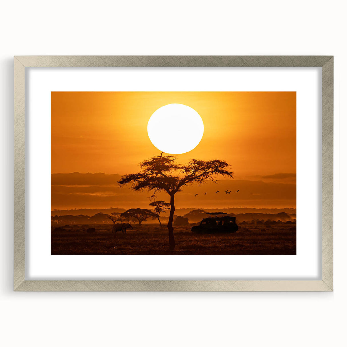 Framed wall art depicting a serene desert landscape, featuring soft earth tones and a silver mat, ideal for modern home decor. Perfect for enhancing any living space's ambiance.