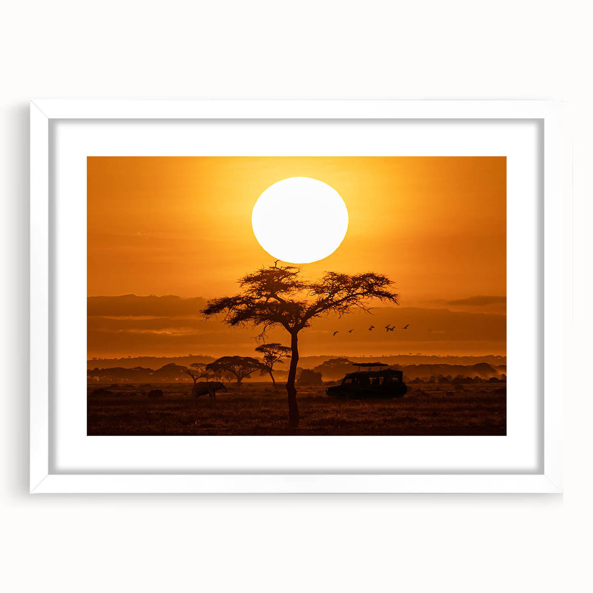 Framed desert landscape wall art featuring warm tones and intricate details, displayed with a white mat. Ideal for home decor in modern or rustic settings.
