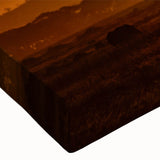 Close-up of a stretched canvas featuring a vibrant desert landscape design, showcasing warm hues of orange and yellow, ideal for home decor and wall art enthusiasts.