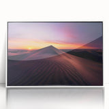 Framed acrylic wall art piece depicting a vibrant desert landscape with warm hues of orange and yellow, featuring a white frame that enhances its modern aesthetic.